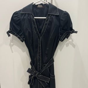 Classic Black dress with white detail stitching. Comes with waist tie.